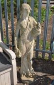 A LARGE CONCRETE GARDEN FIGURE in the form of a scantily clad Grecian lady carrying water ewers ,