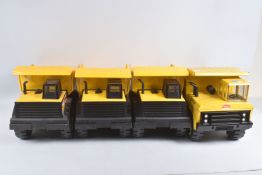 FOUR MIGHTY TONKA TOYS DUMPER TRUCKS, three are later versions with more plastic parts, all appear