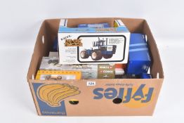 A COLLECTION OF BOXED DIECAST TRUCKS AND TRACTORS, to include an ERTL Ford 4 Wheel Drive Tractor no.