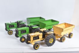 THREE TONKA TOYS FARM TRACTOR AND TRAILERS, two in green ivery, the other in yellow, all appear