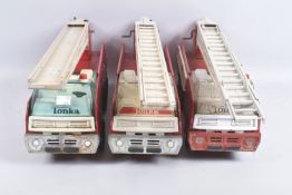 THREE TONKA TOYS AERIAL LADDER FIRE TRUCKS, one is missing extension ladder but ladder raises lowers
