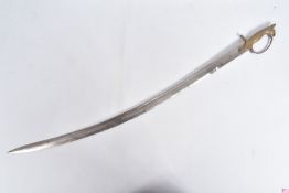 AN INDIAN GOLDEN TEMPLE CURVED SWORD, it has a brass lions head on the hilt and the glade is