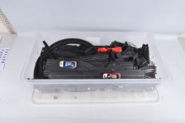 AN UNBOXED ARTIN SLOT CAR RACING SET, contents not checked but appears complete with two cars,