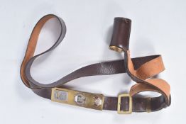 A BROWN COLOURED SAM BROWN STYLE OVER SHOULDER FLAG BEARER BELT, with attached brass fitting with