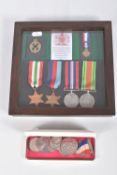 A FRAMED GROUP OF WWII MEDALS AND AN ASSORTMENT OF COINAGE, the medals are un-named as issued and
