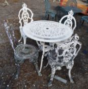 A CAST ALUMINIUM GARDEN TABLE AND FOUR SIMILAR CHAIRS with a pierced fretwork 80cm diameter top.