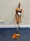 A WORX WG118e ELECTRIC STRIMMER (PAT pass and working). Condition Report: rubber handle covers