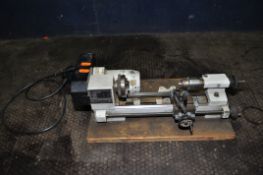 AN EMCO UNIMAT 3 MINI LATHE with a Geteg two speed motor fitted, total length 43cm (PAT pass and