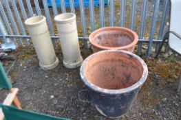A PAIR OF LARGE TERRACOTTA PLANT POTS and a pair of chimney pots, planters 62cm in diameter.