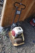 AN INDUSTRIAL COMPACTOR 'wacker plate' with a petrol engine (engine pulls freely but hasn't
