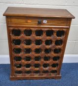 A MODERN HARDWOOD WINE RACK, with a single drawer and thirty bottle sections, width 64cm x depth