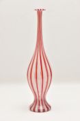 A HANDBLOWN MURANO GLASS 'A CANNE' STRIPED VASE in repeating clear, red and white canes, a narrow