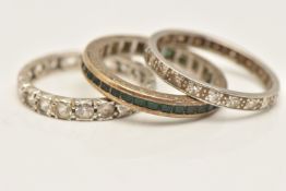 THREE WHITE METAL BAND RINGS, the first set with square cut green stones, stamped 9ct, ring size