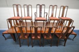 AN EARLY 20TH CENTURY MAHOGANY WIND OUT DINING TABLE, with three additional leaves, raised on square