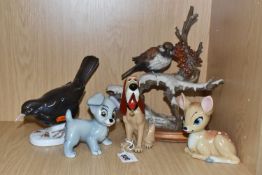 A GROUP OF FIVE ANIMAL THEMED ORNAMENTS to include a group of three Wade Disney animals comprising