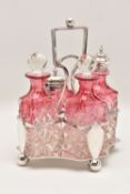 A CONDIMENT SET WITH PLATED STAND, the cranberry flashed cut glass items comprising two bottles with