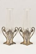 A PAIR OF WMF ART NOUVEAU BUD VASES with pewter bases and cut glass inserts, scrolling foliate