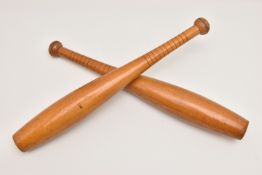 A PAIR OF INDIAN EXERCISE CLUBS, stamped with the number '2', with ridged grip detail, length