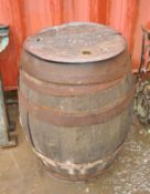 A VINTAGE COOPERED OAK BARREL, with lid, engraved Sheffield 11610 on lid, height 82cm. Condition
