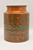 A HORNSEA FLOUR CANISTER, in 'Bronte' pattern, with wooden cover, height 18.5cm x diameter 15.5cm (