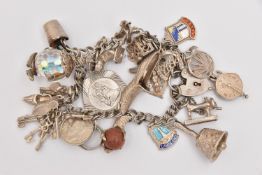 A SILVER CHARM BRACELET, double link bracelet fitted with a heart padlock clasp, hallmarked London