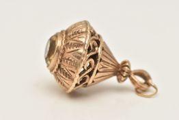 A LARGE YELLOW METAL FOB, a large tear drop form fob, with open work scrolling detail, collet set