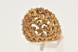 A 9CT GOLD BOMBE RING, a yellow gold brutalist design bombe ring, with heavily textured and open