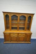 JENTIQUE BOWMAN, A LATE 20TH CENTURY OAK DRESSER, fitted with four glass doors, atop a base with two