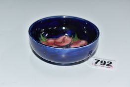 A MOORCROFT POTTERY 'CLEMATIS' FOOTED BOWL on a blue ground, height 3.5cm x diameter 8cm (1) (