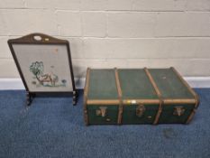 A GREEN CANVAS TRAVELING TRUNK, width 93cm x depth 54cm x height 30cm, along with another trunk, and