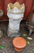 A CHIMNEY POT, and a terracotta chimney topper (2) Condition Report: some peaks missing from pot