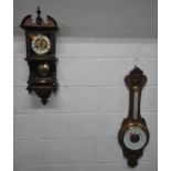 A 20TH CENTURY WALL CLOCK, with a broken arch pediment, a single finial, a square glass door