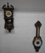 A 20TH CENTURY WALL CLOCK, with a broken arch pediment, a single finial, a square glass door