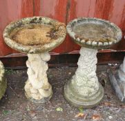 TWO CONCRETE BIRD BATHS, both with tree stump bases, one with squirrels climbing the trunk, the