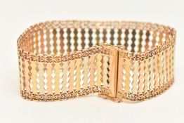 AN ITALIAN TRI COLOUR BRACELET, a wide articulated bracelet comprised of yellow, rose and white
