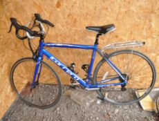 A CARRERA ZELOS ROAD RACING BIKE, with 14 speed Shimano gears, 21in frame, rear rack and Cinelli