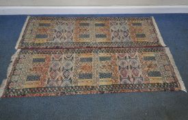 A PAIR OF GABBEH CARPET RUNNERS, with repeating geometric patterns, surrounded by a multi-strap