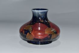A MOORCROFT POTTERY 'POMEGRANATE' VASE of squat form, with green signature to the base alongside