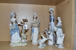 A GROUP OF LLADRO AND SIMILAR FIGURINES to include a 'Stepping Out' No. 1537 designed by Juan Huerta