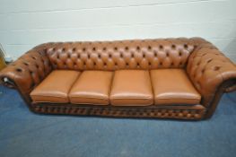 A BROWN LEATHER FOUR SEATER CHESTERFIELD SOFA, with buttoned back and armrests, length 240cm x depth