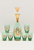 A GREEN GLASS DECANTER SET, comprising decanter with hollow blown glass stopper and six small