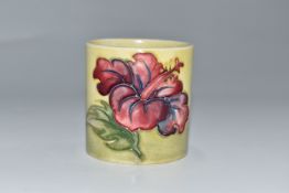 A MOORCROFT POTTERY 'HIBISCUS' BRUSH POT on a green ground, with a paper Queen Mary sticker to the