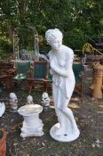 AN ALMOST LIFESIZE CONCRETE GARDEN FIGURE, in the form of a scantily clad Grecian lady, height
