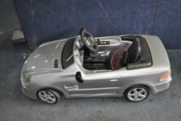A MERCEDES SPORTSCAR CHILDS ELECTRIC MODEL CAR, with charger, length 120cm (PAT pass but battery