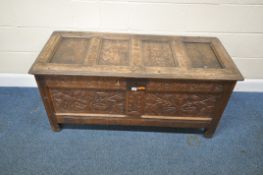 A GEORGIAN OAK COFFER, with a four panel lid, that’s enclosing a candle box, the front and sides
