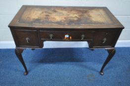 AN EARLY 20TH CENTURY MAHOGANY DESK, with a distressed leather writing surface, three frieze
