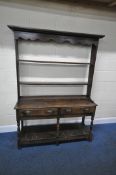 A GEORGIAN AND LATER OAK DRESSER, the three tier plate rack with a wavy apron, atop a base with