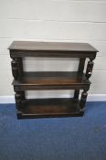 AN 18TH CENTURY STYLE OAK THREE TIER BUFFET, with repeating geometric patterns, raised on turned