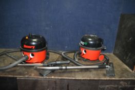 TWO NUMATIC 'HENRY' VACUUM CLEANERS comprising of a HVR 200 and a HVR200-a (not working and taped