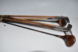EIGHT VINTAGE GOLF CLUBS, to include five irons, featuring Scottish examples by F. Forgon & Sons